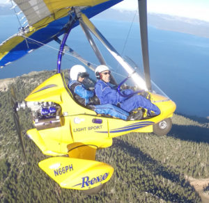 Student at the controls of powered hang glider.